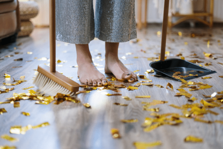 a person holding a broom