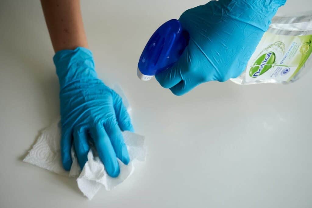 A cleaning lady service following SOPs while cleaning in a house in Rockville.